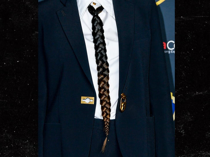 0935ac409d744f8d93f49a0d0b40c300_md maggie gyllenhaal CinemaCon hair tie getty 3