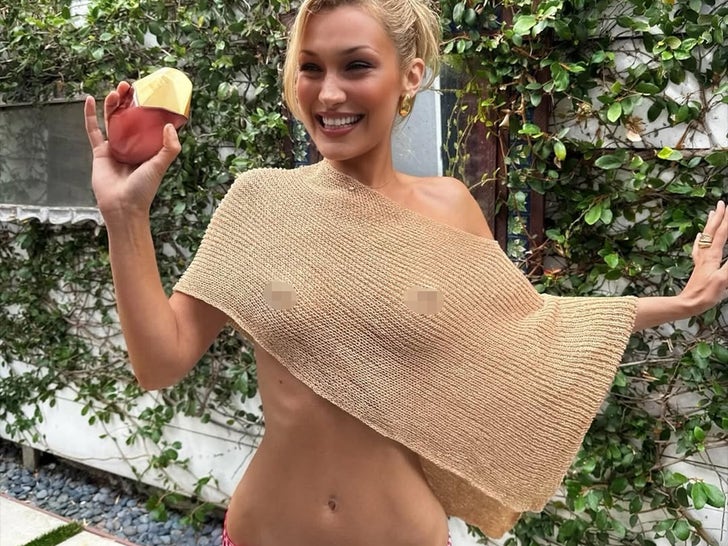 0a0a62446f07498ea3b8f4492adba894_md Bella Hadid Goes No Bra In Perfume Promo!