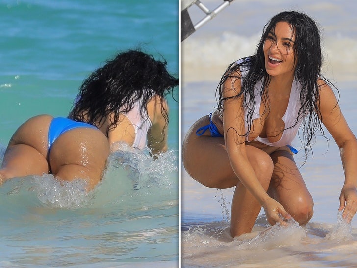 Kim Kardashian Laughing in Bikini for Beach Photoshoot