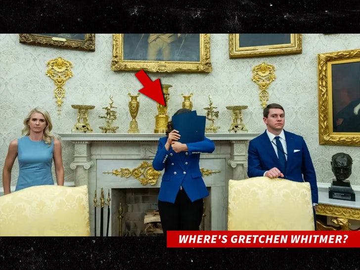 gretchin whitmer holding blue folder in front of her face sub Eric Lee-The New York Times swipe 2