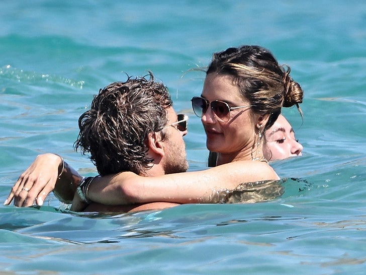 Alessandra Ambrosio and Buck Palmer Enjoy Beach Swim in Ibiza