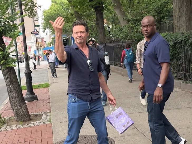 061825-hugh-jackman-hailing-cab