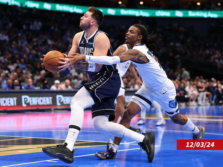 5e963e8034c84902a7d3ed9e3dc4f8ef_md Luka Doncic #77 of the Dallas Mavericks drives with the ball past Ja Morant #12 of the Memphis Grizzlies during the second half of an Emirates NBA Cup game