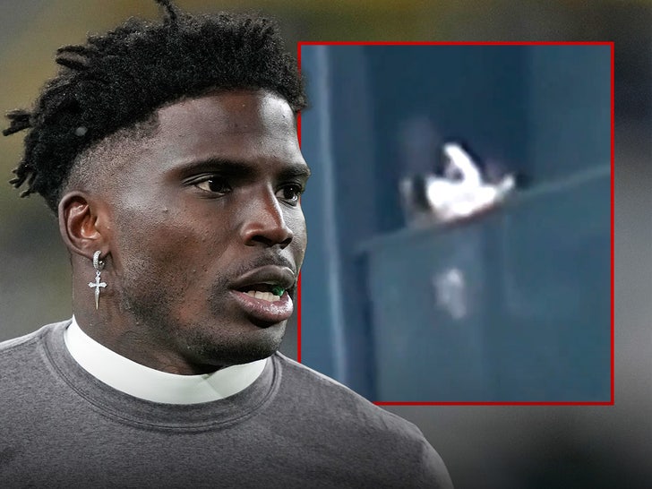 tyreek hill baby over balcony main getty x composite