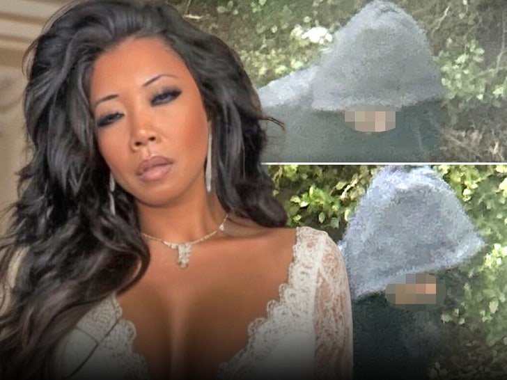 c6f52bf2f9a14ff88ee2e856388aa21b_md chrissie wunna hooded figure main chrissie wunna