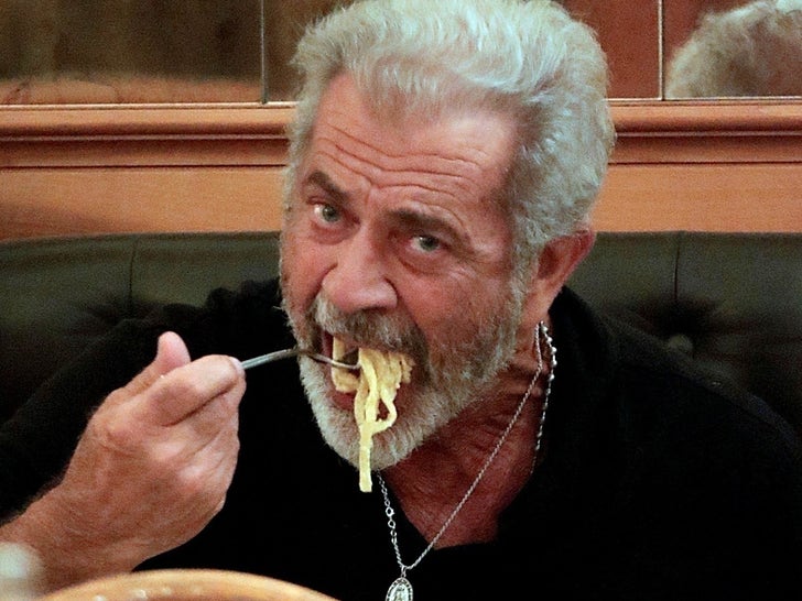 ce04ceaa8c0a403f9246fe884983123d_md Mel Gibson Gets Silly With His Pasta While Dining Solo In Rome