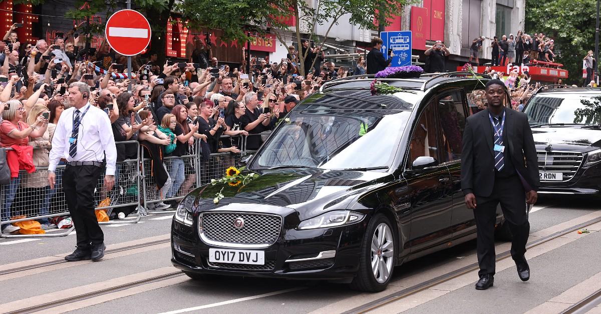 ozzy-osbourne-funeral-hearst-osbourne-1-1753886094101 Thousands of fans gathered in the street to honor Ozzy.