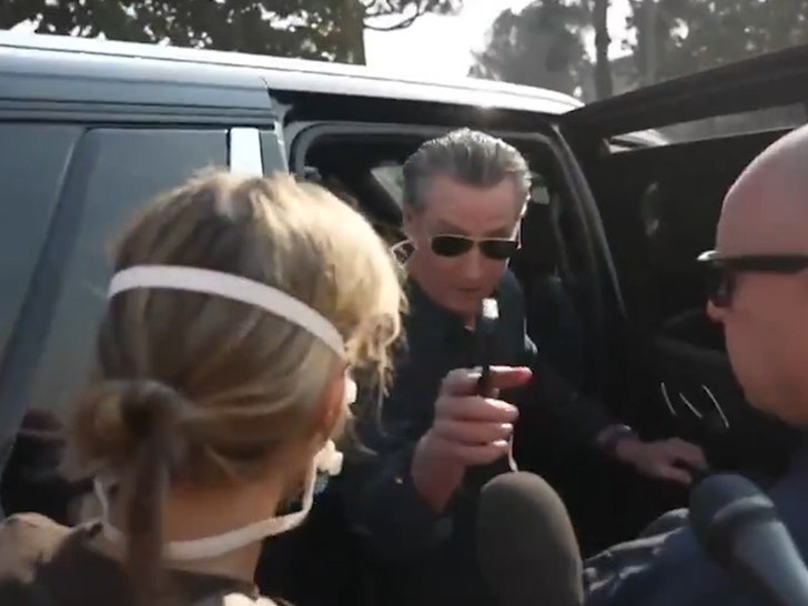 2bf7699291a94c1d9a834c695b985aa6_md 010925-gavin-newsom-getting-in-car-1