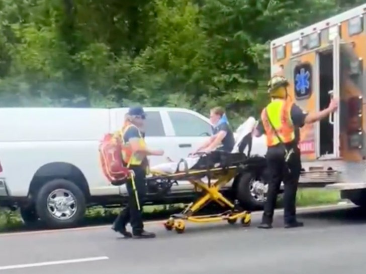 6e1ccd91d9c8491996a660141efbe3e1_md woman on stretcher after accident car twitter 1