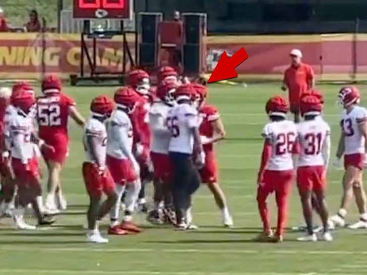 travis kelce pushing teammate.