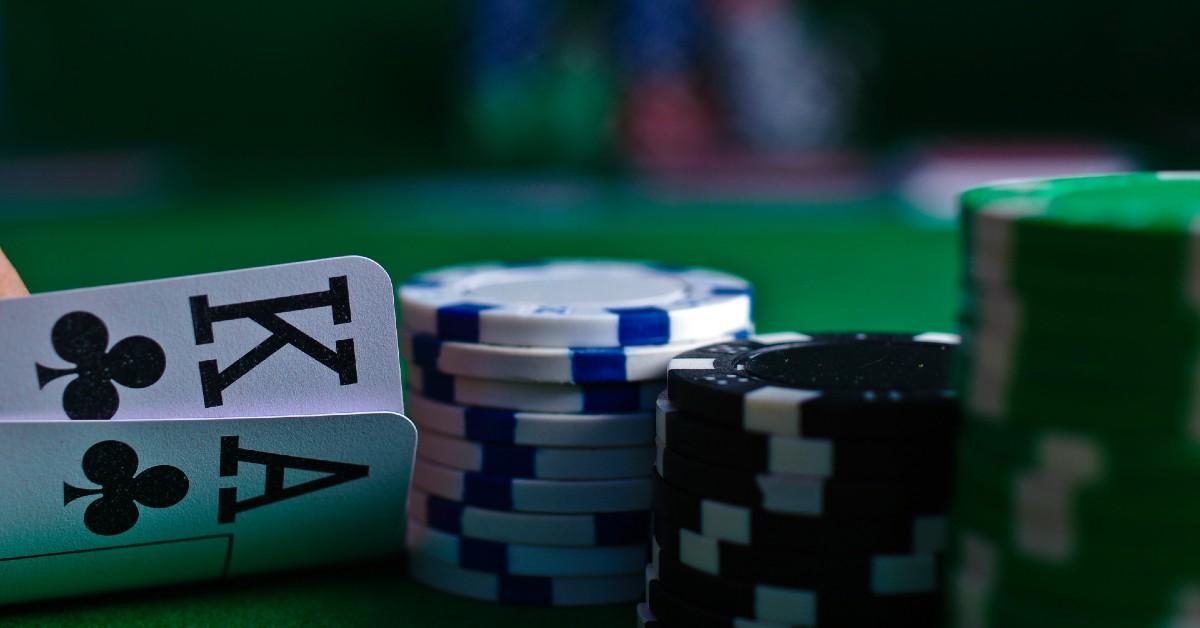 poker-2-unsplash-1762445910474 Photo of poker chips and playing cards