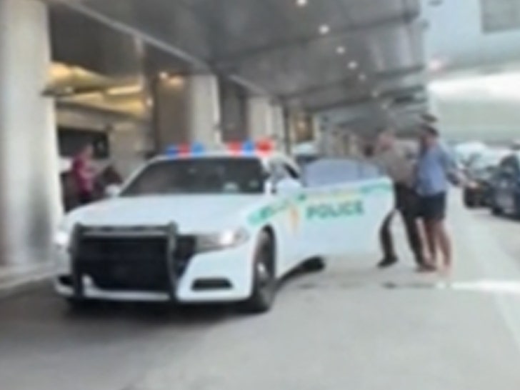 070824-uber-arrest-cop-car-primary