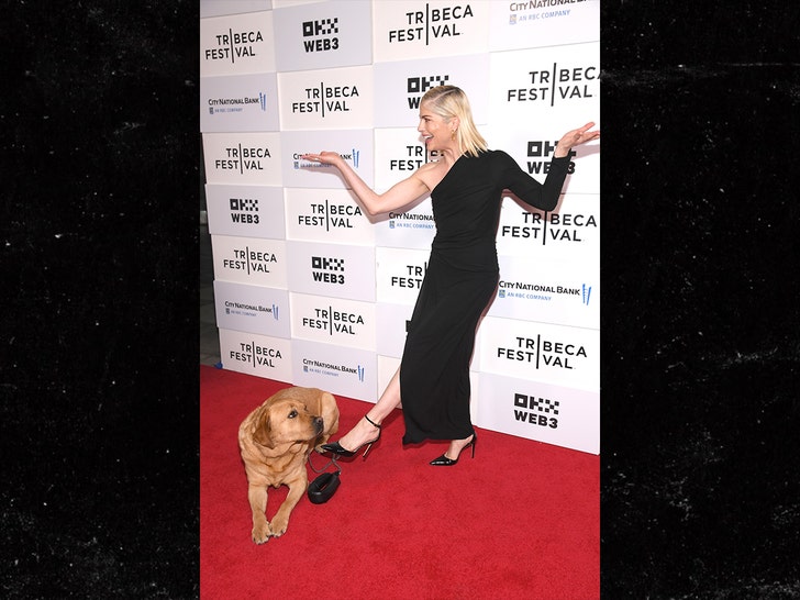 selma blair and dog on red carpet