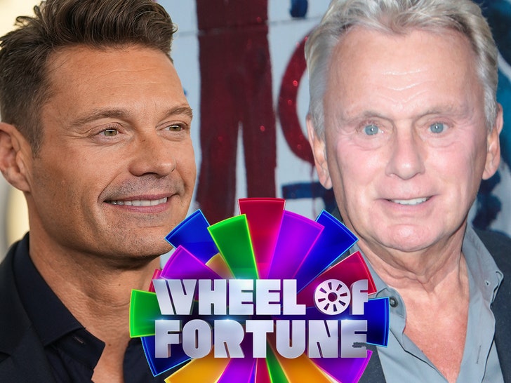 0609 Ryan Seacrest Pat Sajak wheel getty comp