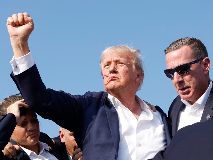 e5083b47b1e2408da97dc82b9ec16537_md-1 Donald Trump Rushed Off Stage at Rally After Shooting