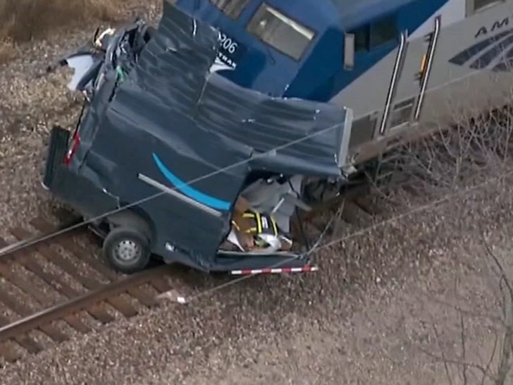 amazon truck split in half by train