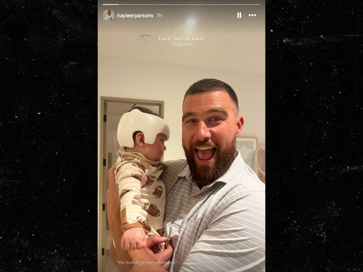 travis kelce holding baby