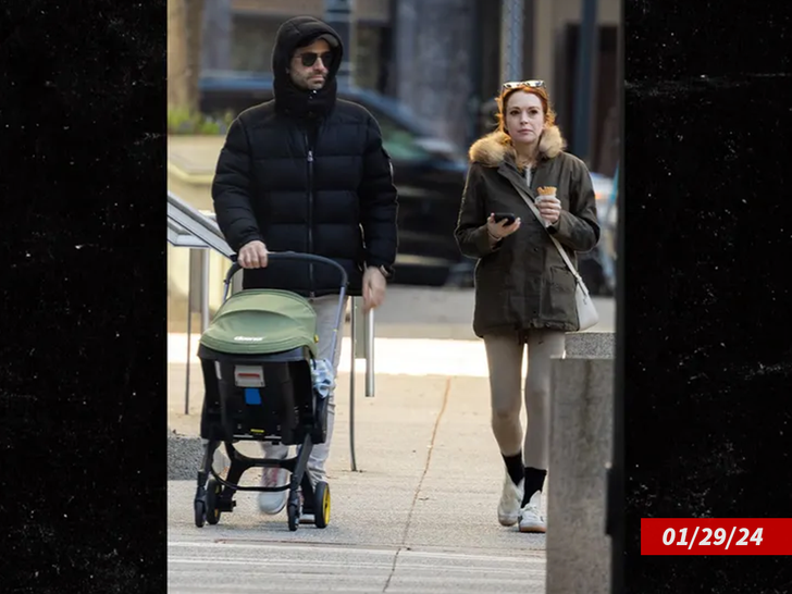 7426709d9e3a46c38f84e219abc42e1f_md Lindsay Lohan Takes Baby on Stroll with Husband During Netflix Shoot