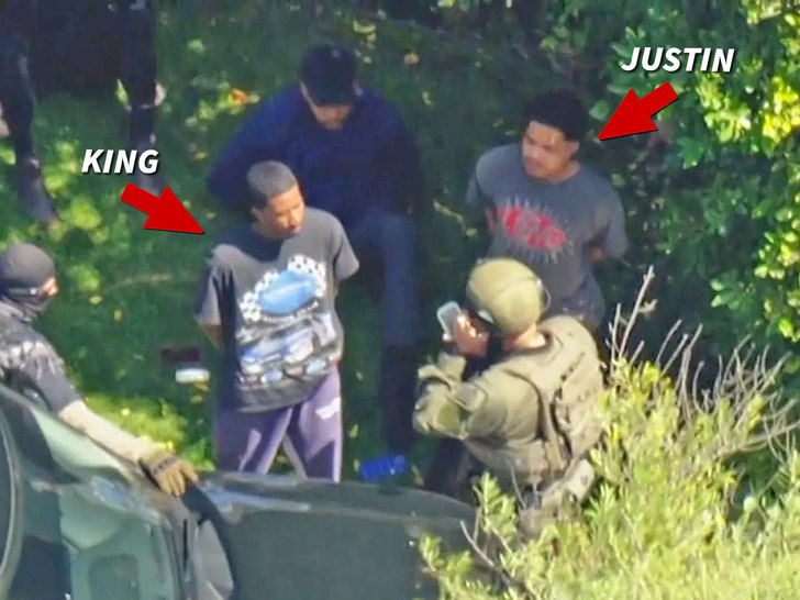 9b4641ab927b48dbb0bd12adfafe2d57_md-1 King and Justin Combs in handcuffs standing with federal agents.