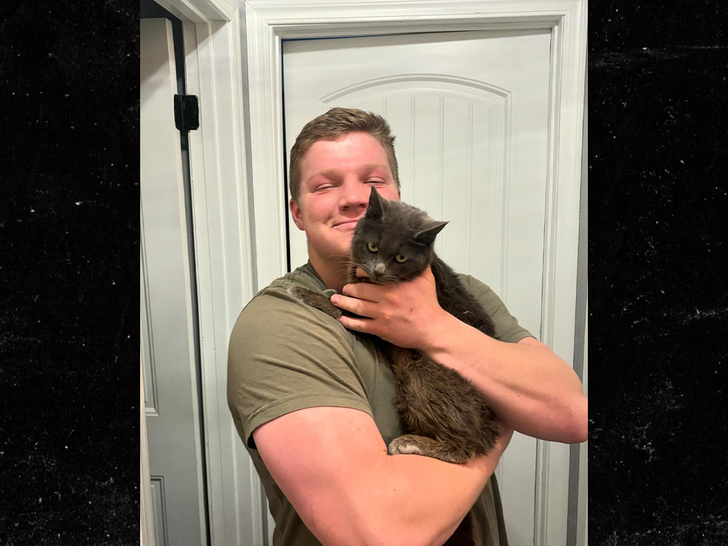 Robert Brown with his cats sub 2