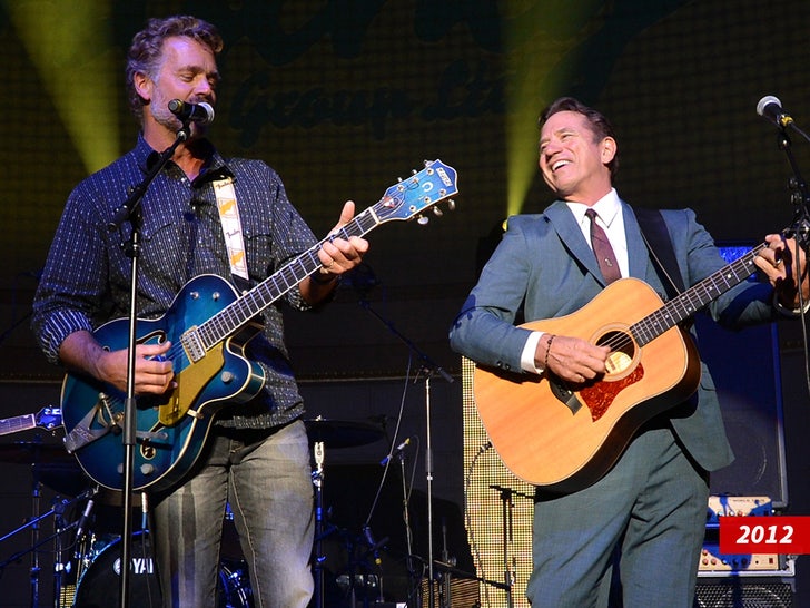 john schneider performing onstagr year swipe