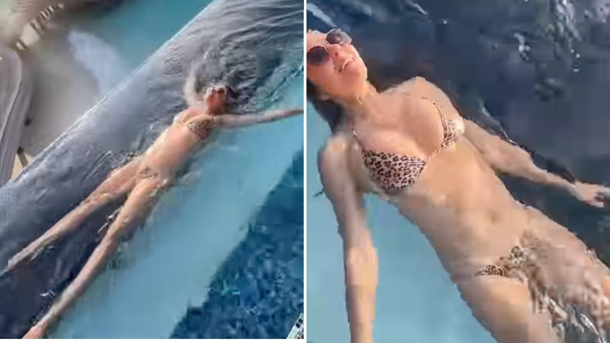 Image of Elizabeth Hurley shows off her toned figure in a leopard-print bikini by the pool.