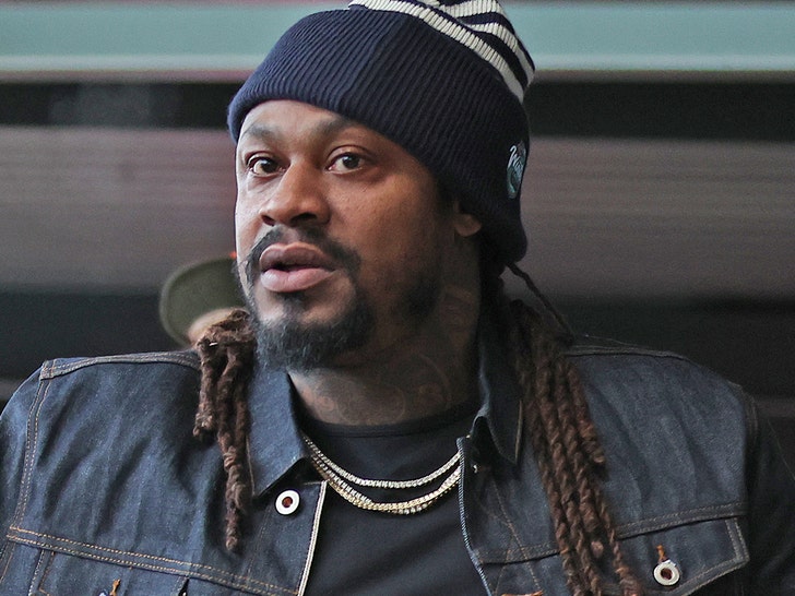Marshawn Lynch wearing a beanie and jean jacket.