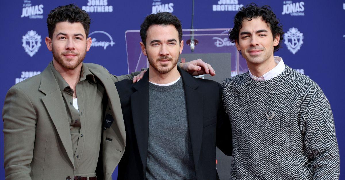 The Jonas Brothers face internal tension as Nick positions his solo album as a break from the group dynamic.