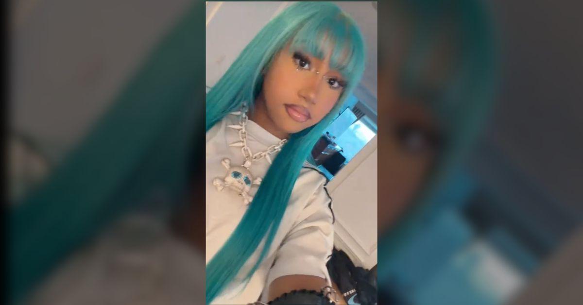 Image of North paired the look with her long, blue wig and a full face of makeup.