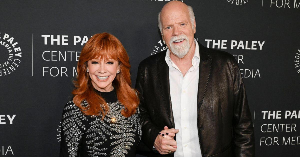 reba-mcentires-dollywood-wedding-parton-front-center-3-1763655512319 Insiders said McEntire is considering a holiday wedding while Rex Linn leaves the planning entirely in her hands.