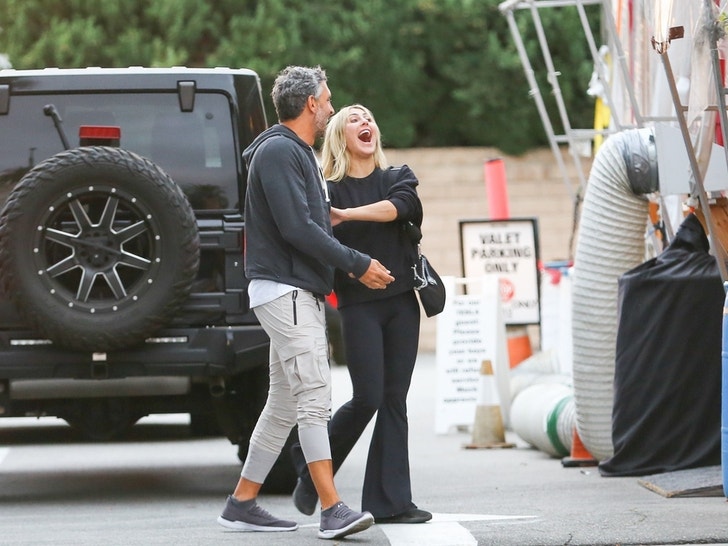 Mauricio and Emma Slater Holding Hands