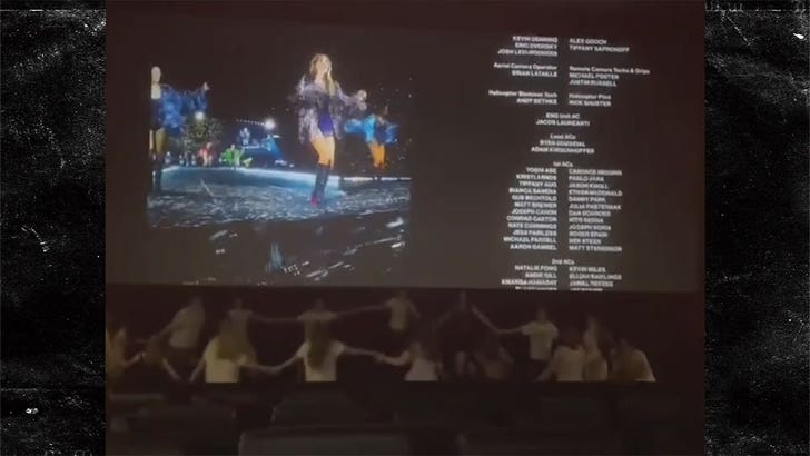 101423-taylor-swift-movie-holding-hands-kal