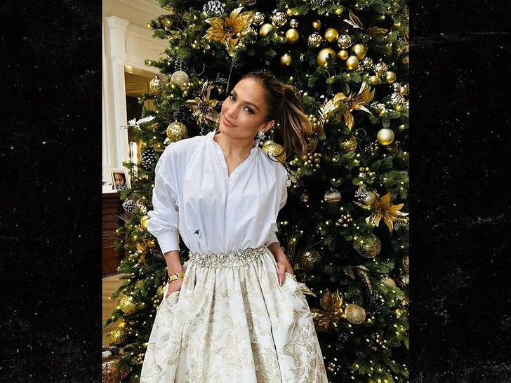 jennifer lopez in front of christmas tree