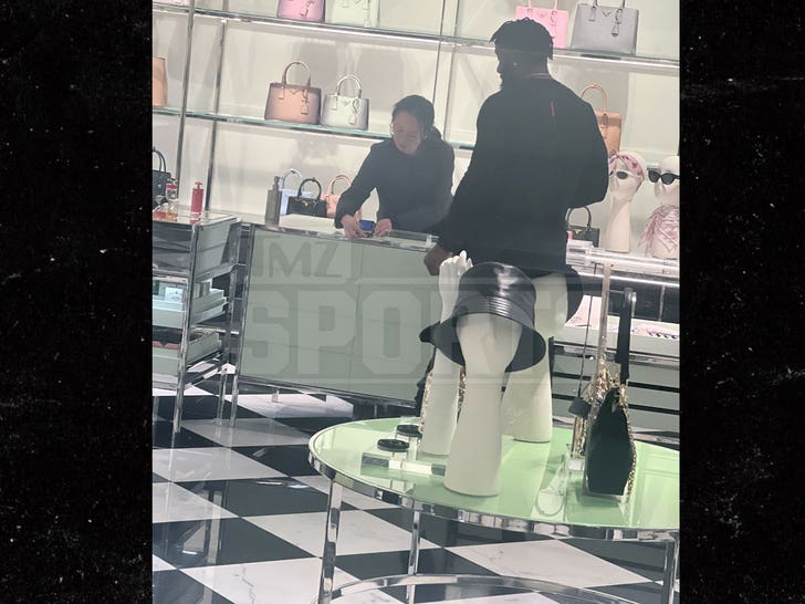 Navorro Bowman on a prada shopping spree