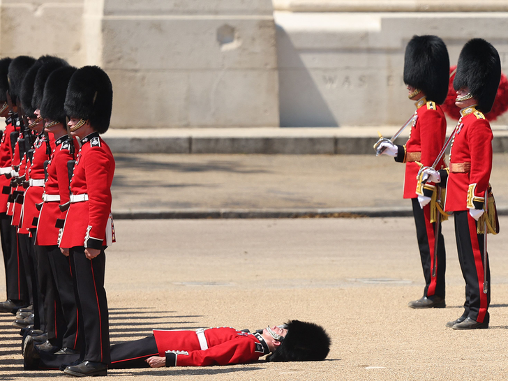 061123 Grenadier Guards is carried after fainting during the Colonel's Review 2  - getty