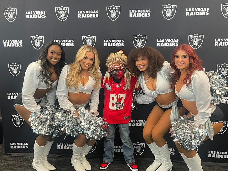 Kansas City Chiefs Fan and raiders cheerleaders