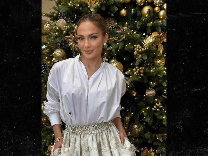 jennifer lopez in front of christmas tree