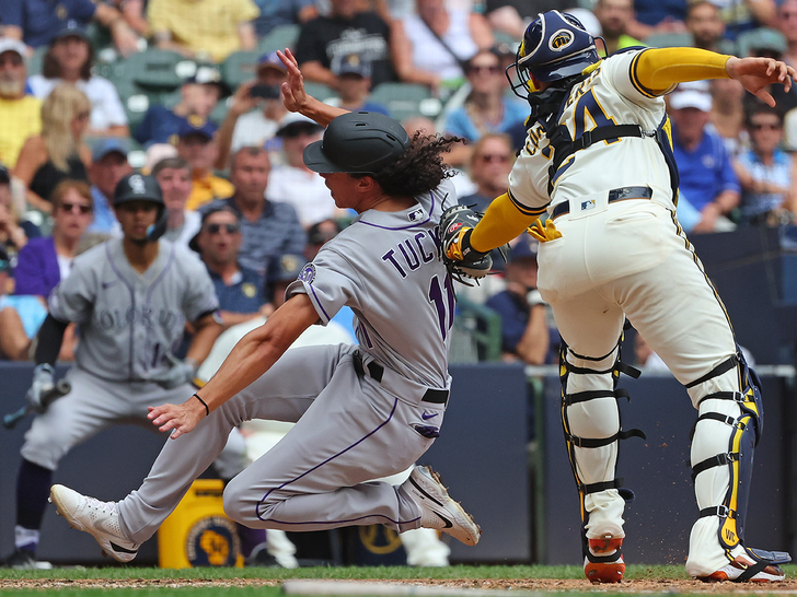 Cole Tucker #11 of the Colorado Rockies is tagged