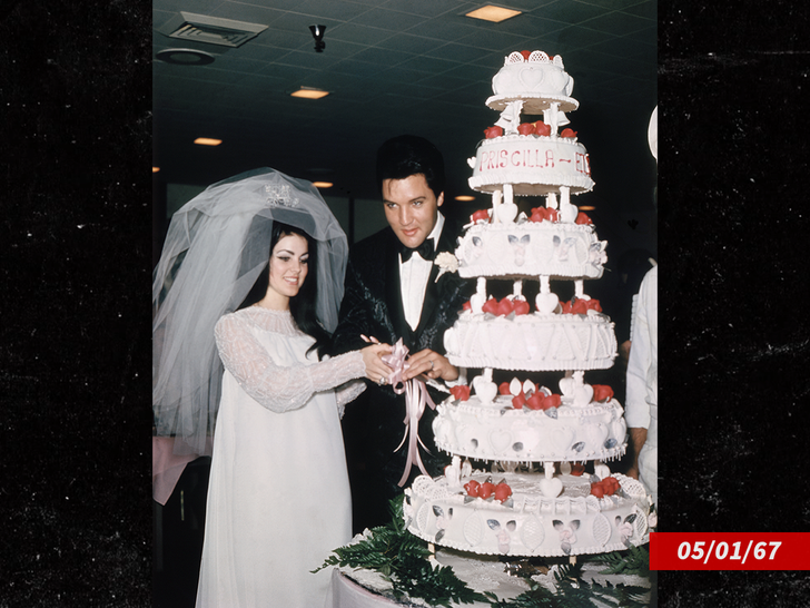 9986504119d447f88e89d2f488b2ecb6_md-2 Elvis Presley cuts wedding cake with his bride, the former Priscilla Ann Beaulieu