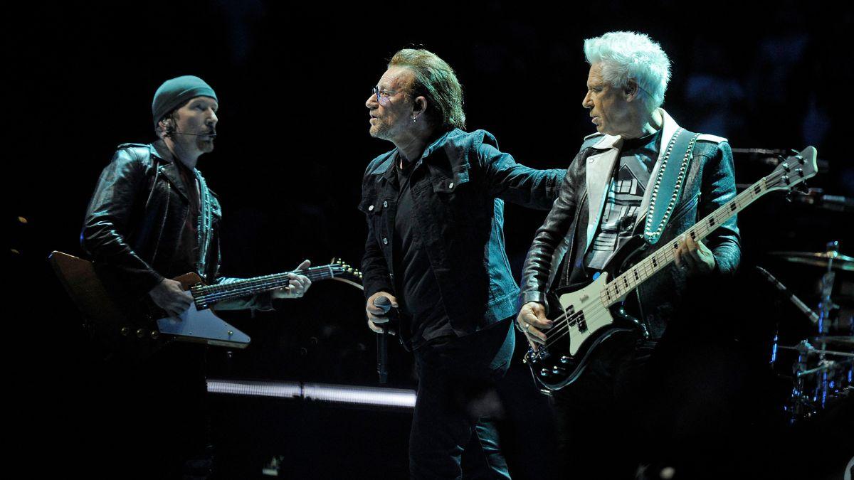 Photo of  Edge, Bono and Adam Clayton.