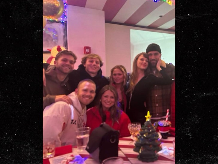 taylor swift and travis kelce at party with friends