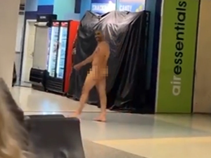 092123-naked-guy-airport-smile-primary