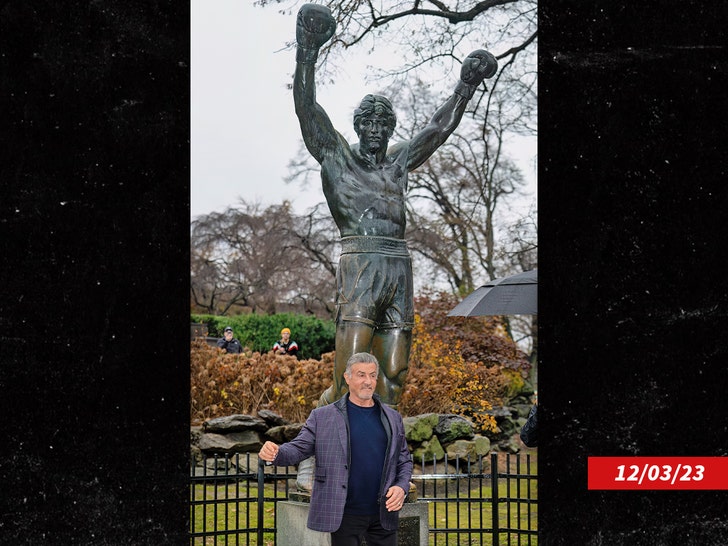 Sylvester Stallone in front of rocky statue getty 1